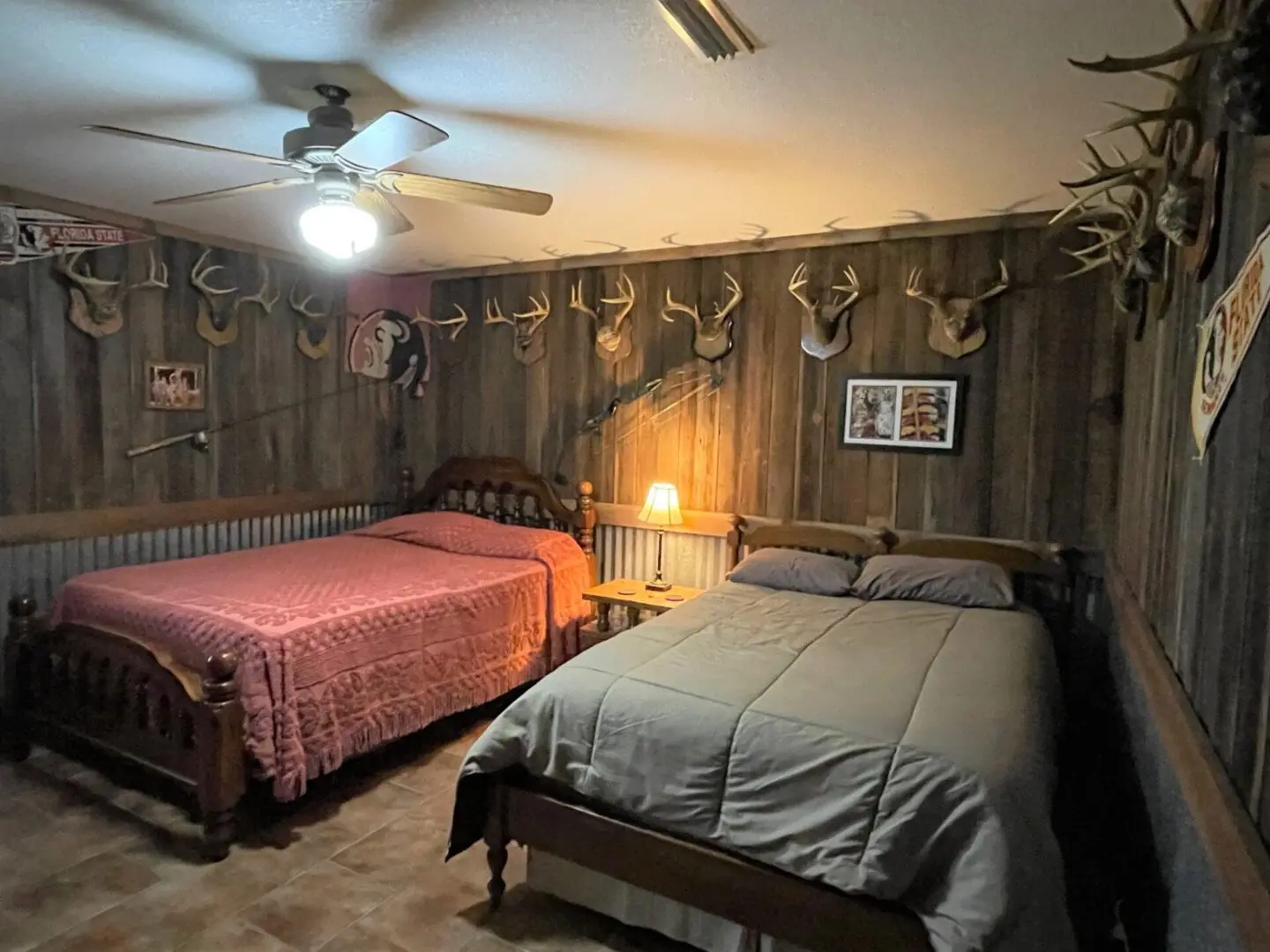 bedroom with a lot of deer antler mounts